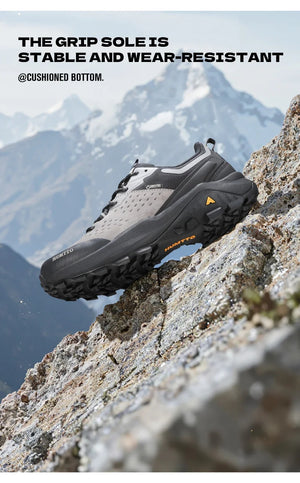 Chaussures de randonnée / trail low-top pour femme "HUMTTO - HT-160560B" grises et blanches en cuir véritable, semelle noire, accents roses, logo Humtto sur le côté et le dessus-idéales pour la randonnée.