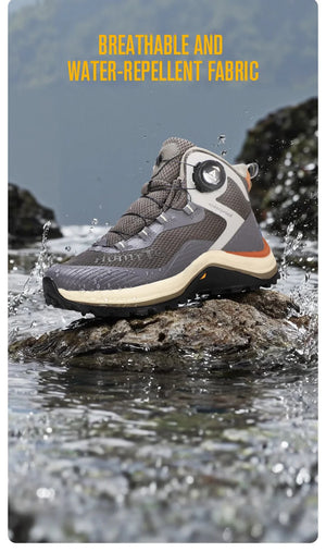 Gris et orange Humtto HT-260587E mid-top bottines alpinisme avec protection Splash-proof, semelle crantée et molette latérale de serrage, présentées sur fond blanc avec logo Humtto. Idéales comme chaussures hydrophobes pour enfants aventuriers.