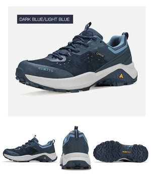 Chaussures de randonnée / trail low-top pour femme "HUMTTO - HT-160560B" grises et blanches en cuir véritable, semelle noire, accents roses, logo Humtto sur le côté et le dessus-idéales pour la randonnée.