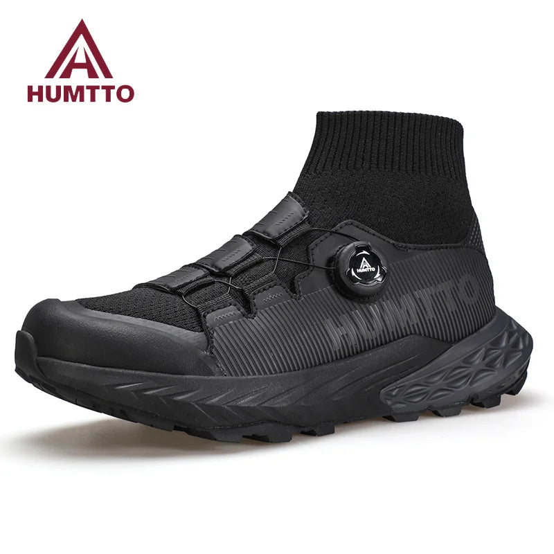 Les chaussures de randonnée Humtto "HUMTTO - HT-350632A" présentent un design noir, une semelle épaisse, un collier de chaussettes intégré, un cadran réglable et une adhérence antidérapante - parfaites comme chaussures de randonnée homme antidérapantes.