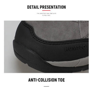 A single Humtto - HT-250366A mid-top randonnée/bottine d'expédition pour homme, gris et noir, antidérapant, protection splash-proof, maintien cheville, lacets, logo Humtto latéral et languette, sur fond blanc.