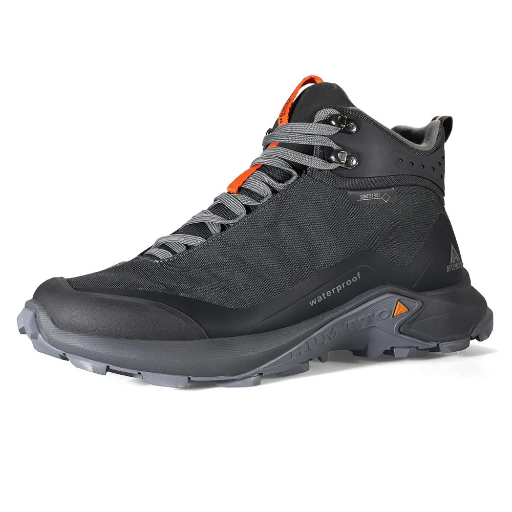 Humtto chaussures de randonnée mid-top pour homme "HT210500A" avec protection splash-proof, semelle robuste, fermeture à lacets et logo de la marque sur fond blanc.