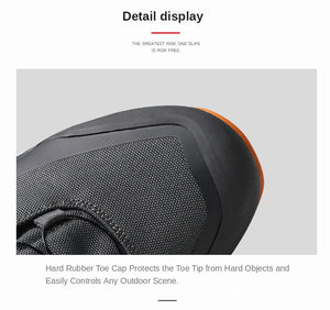 Les chaussures de randonnée Humtto HT-220838A pour hommes sont dotées d'une protection contre les éclaboussures, d'un système de laçage à cadran, d'un design gris et noir avec une bande de roulement orange, de logos visibles, et sont des chaussures de randonnée parfaites pour les sentiers accidentés.