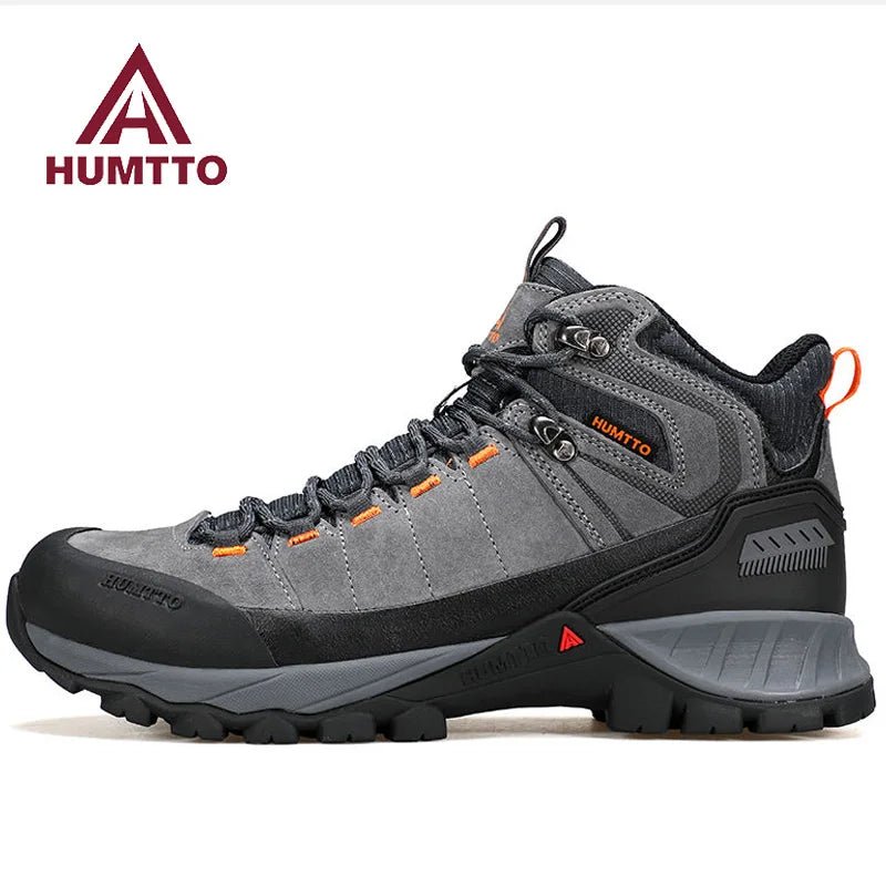 Chaussure de randonnée gris et noir Humtto "HT-250486A" pour homme, avec des accents orange, du cuir véritable, des œillets métalliques, une semelle robuste et la technologie Static Waterproof, montrée de profil sur fond blanc.