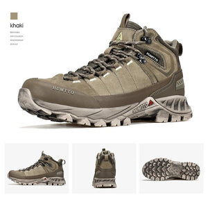 Chaussure de randonnée gris et noir Humtto "HT-250486A" pour homme, avec des accents orange, du cuir véritable, des œillets métalliques, une semelle robuste et la technologie Static Waterproof, montrée de profil sur fond blanc.