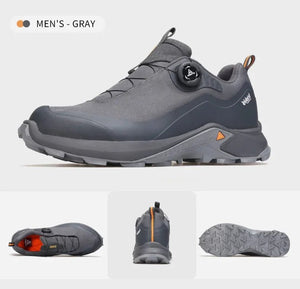 Les Humtto Chaussures de randonnée low-top pour homme "HT-140660A" en gris, dotées d'une semelle robuste, d'un système de laçage à molette et de la Technologie Event® Dynamic Waterproof, sont présentées sur fond blanc.