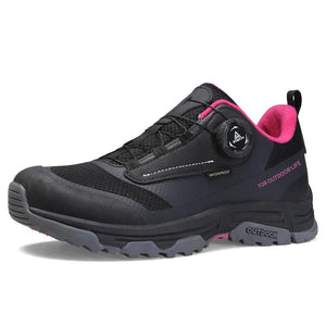La chaussure de trail/course Humtto "HT-120045B" pour femmes présente une tige en maille rose et violette, une semelle épaisse, une protection contre les éclaboussures et un système de laçage twist-lock, alliant confort élégant et fonctionnalité.