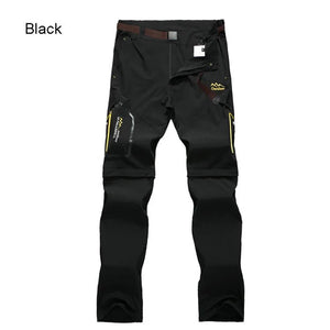 Pantalon randonnée homme Trvlwego AD083 noir 2-en-1, short amovible, poches zippées, détails jaunes, fond blanc.