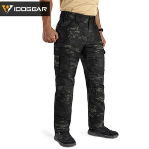 Le pantalon "IDOGEAR - IGPA3213" tactique flexible avec coupe 3D est présenté debout sur fond blanc, avec le logo IDOGEAR en haut à gauche.
