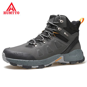Les chaussures de randonnée montantes pour hommes Humtto "HUMTTO - HT-220463A" sont dotées d'une tige résistante aux éclaboussures et d'une semelle robuste avec des accents orange, soulignant leur design et leur protection imperméable.