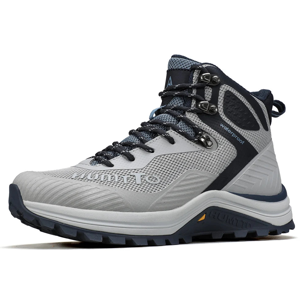 Les HUMTTO - HT-250460A chaussures de randonnée mid-top pour homme offrent une technologie Static Waterproof, avec tige mesh et synthétique, semelle robuste - bottines alpinisme marron/vert conçues pour confort et durabilité sur tous les sentiers.