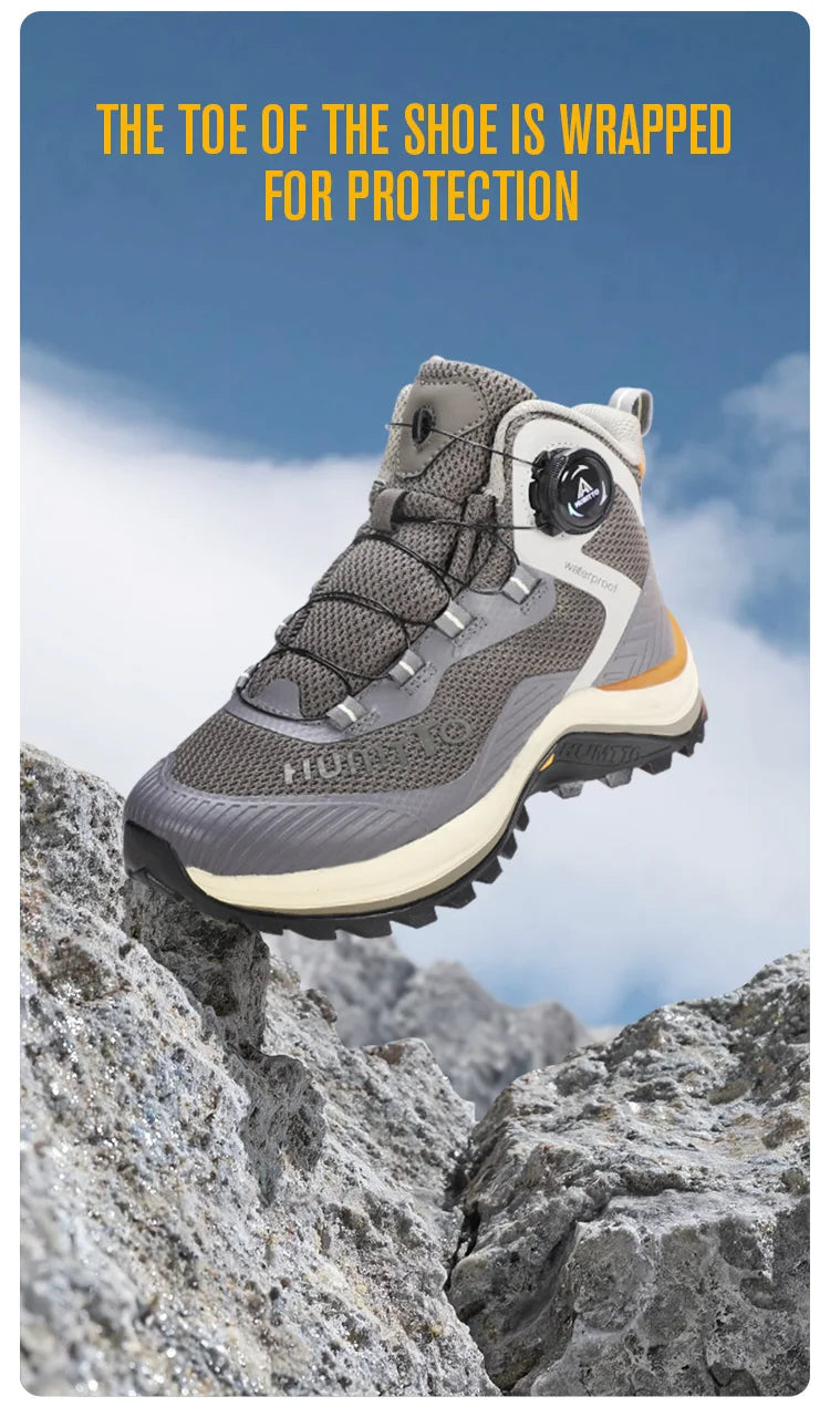 Gris et orange Humtto HT-260587E mid-top bottines alpinisme avec protection Splash-proof, semelle crantée et molette latérale de serrage, présentées sur fond blanc avec logo Humtto. Idéales comme chaussures hydrophobes pour enfants aventuriers.