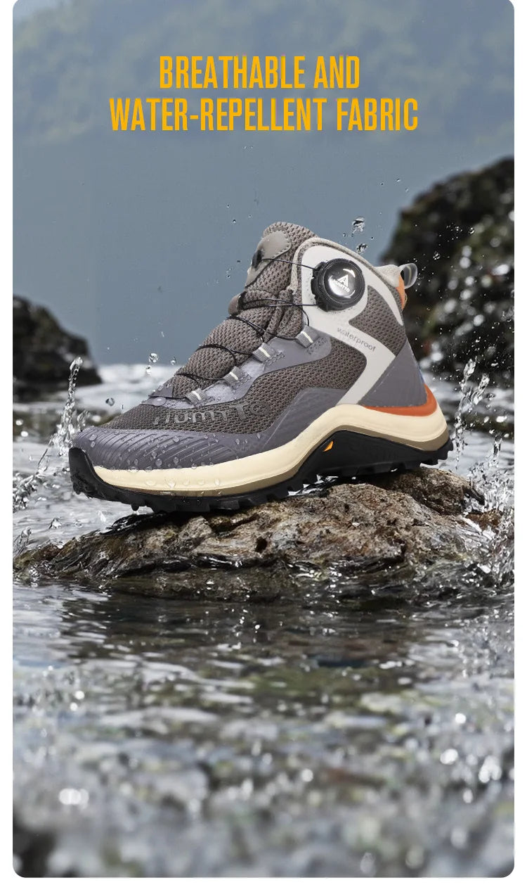 Gris et orange Humtto HT-260587E mid-top bottines alpinisme avec protection Splash-proof, semelle crantée et molette latérale de serrage, présentées sur fond blanc avec logo Humtto. Idéales comme chaussures hydrophobes pour enfants aventuriers.