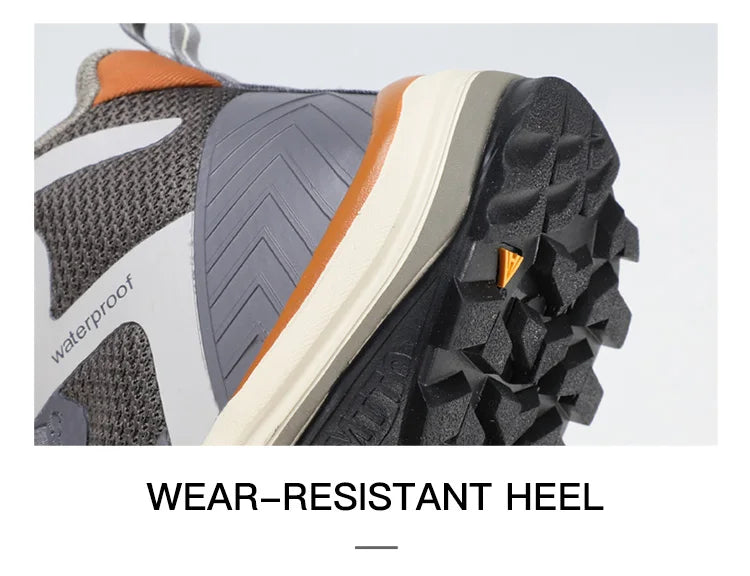 Gris et orange Humtto HT-260587E mid-top bottines alpinisme avec protection Splash-proof, semelle crantée et molette latérale de serrage, présentées sur fond blanc avec logo Humtto. Idéales comme chaussures hydrophobes pour enfants aventuriers.