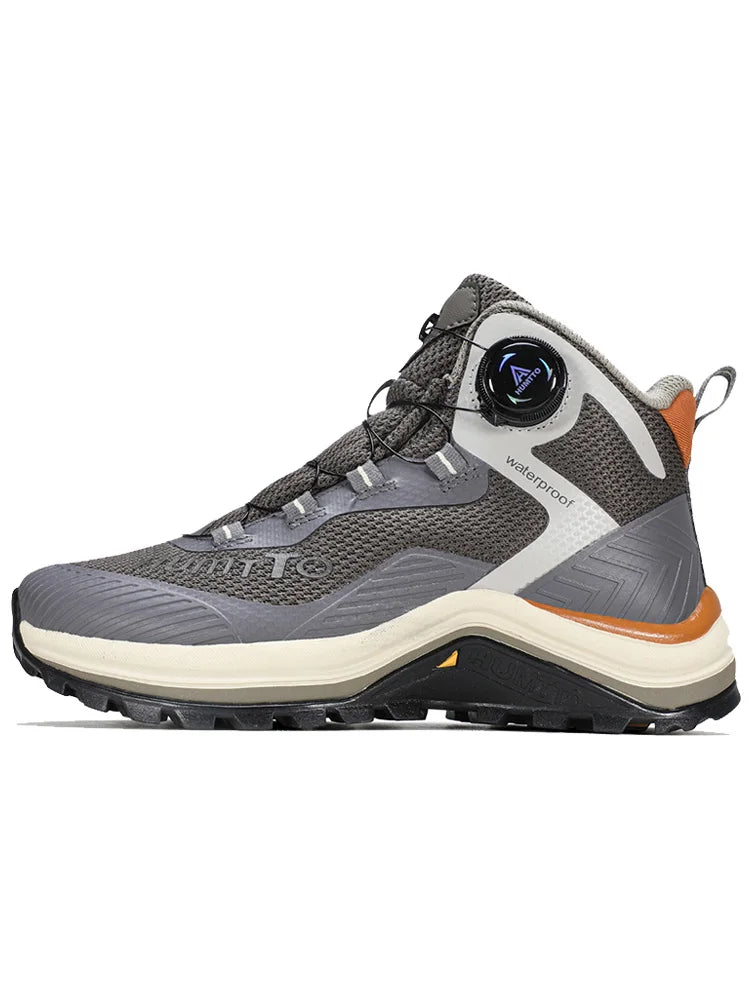 Gris et orange Humtto HT-260587E mid-top bottines alpinisme avec protection Splash-proof, semelle crantée et molette latérale de serrage, présentées sur fond blanc avec logo Humtto. Idéales comme chaussures hydrophobes pour enfants aventuriers.