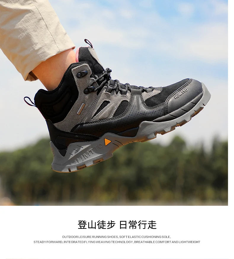 Les bottines tactiques 100% imperméables Humtto - HT-240760A pour homme, marron et noires, avec semelle robuste, tige en mesh et suède, et fermeture à lacets, sont idéales pour ceux recherchant des chaussures imperméables.