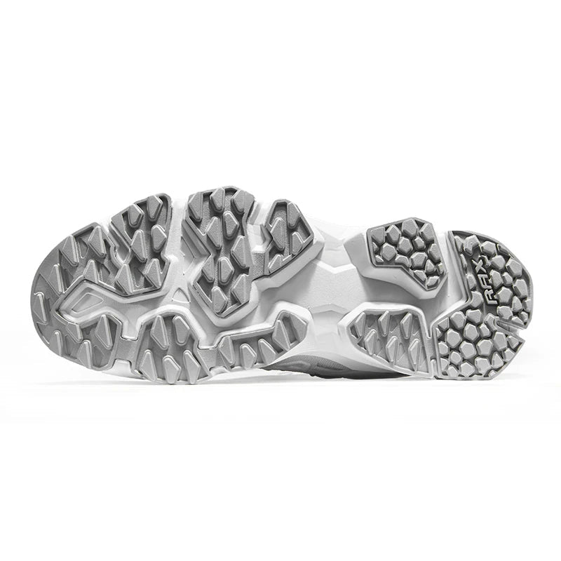 Gros plan sur la semelle blanche et grise des chaussures de trail Rax homme, crampons Free Flexible pour meilleure adhérence.