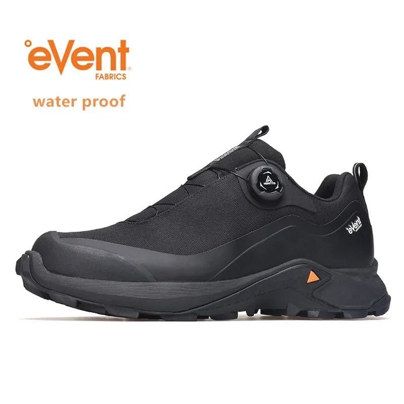 Les Humtto Chaussures de randonnée low-top pour homme "HT-140660A" en gris, dotées d'une semelle robuste, d'un système de laçage à molette et de la Technologie Event® Dynamic Waterproof, sont présentées sur fond blanc.